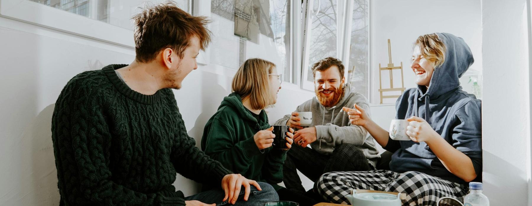 a group of people sitting around a table